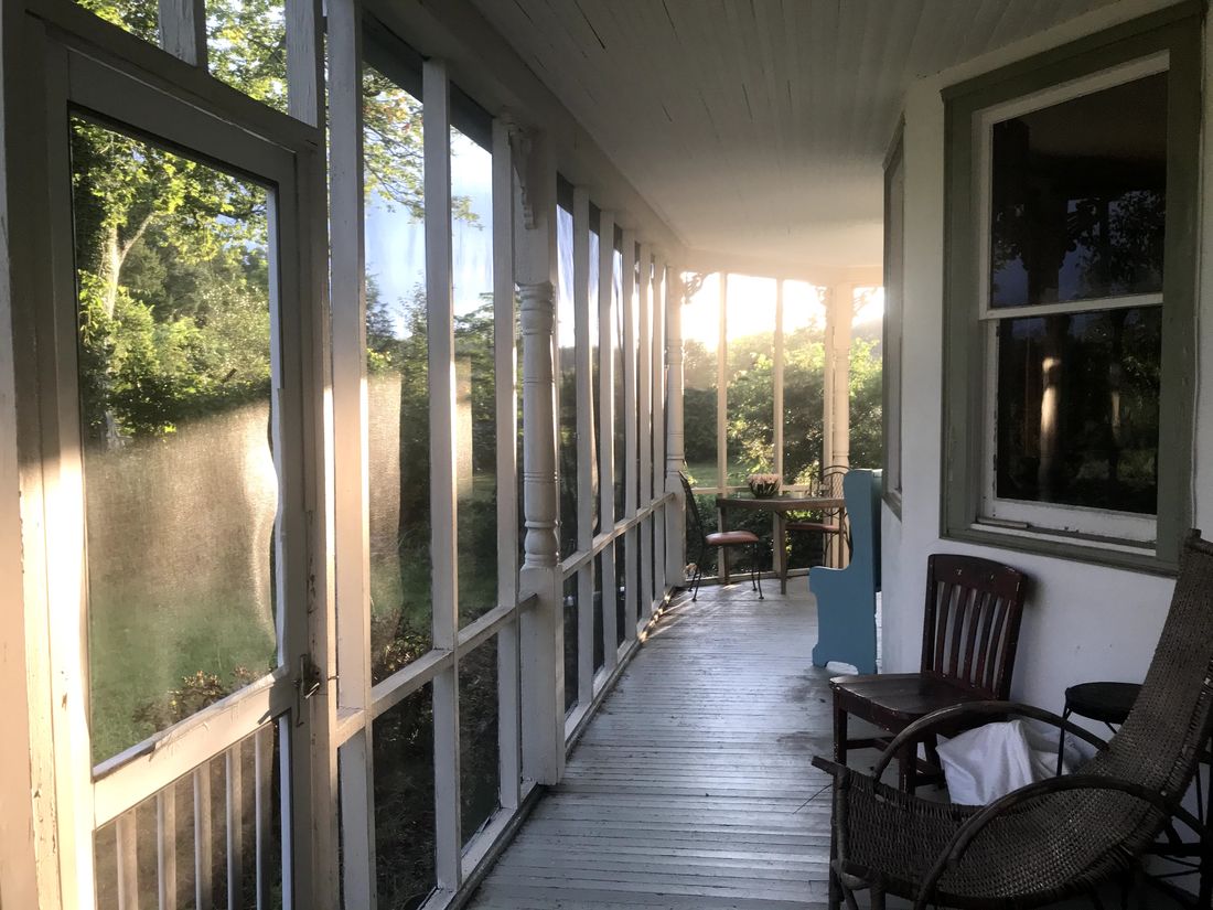 Golden light on the farmhouse porch